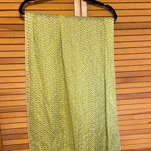 Bright green and white scarf with fringe